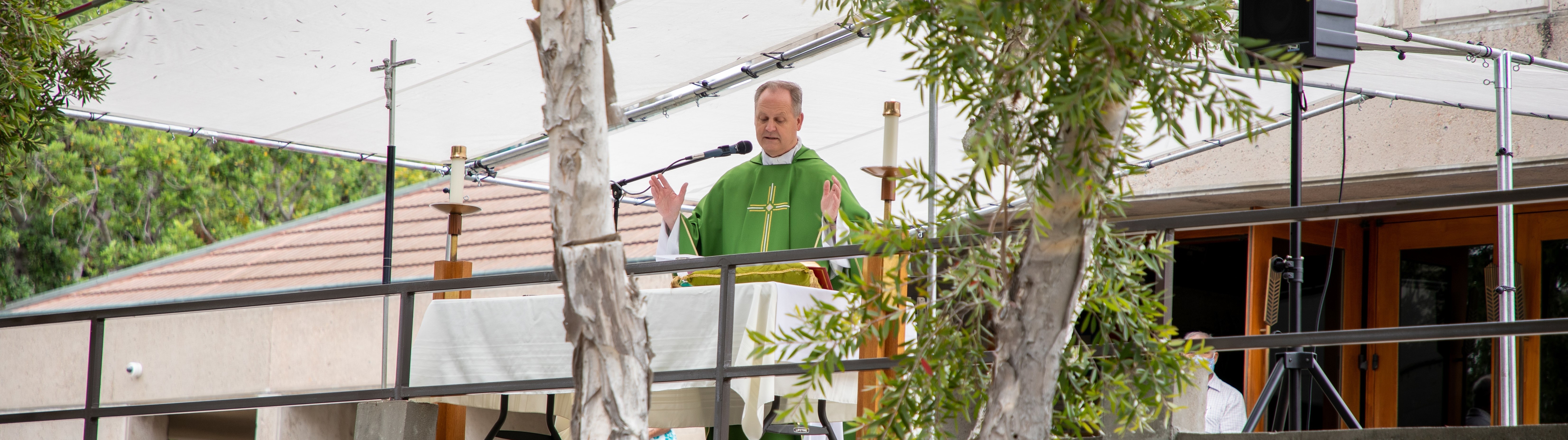 Pmcguine Celebrating Mass Outdoors long narrow